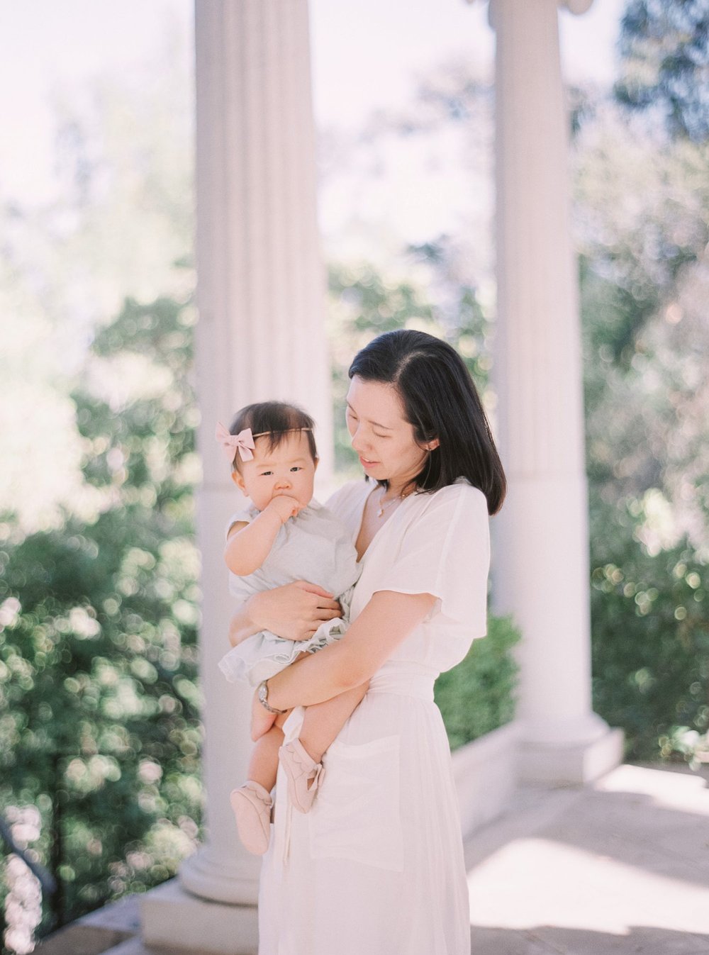 mom and newborn with columns for session