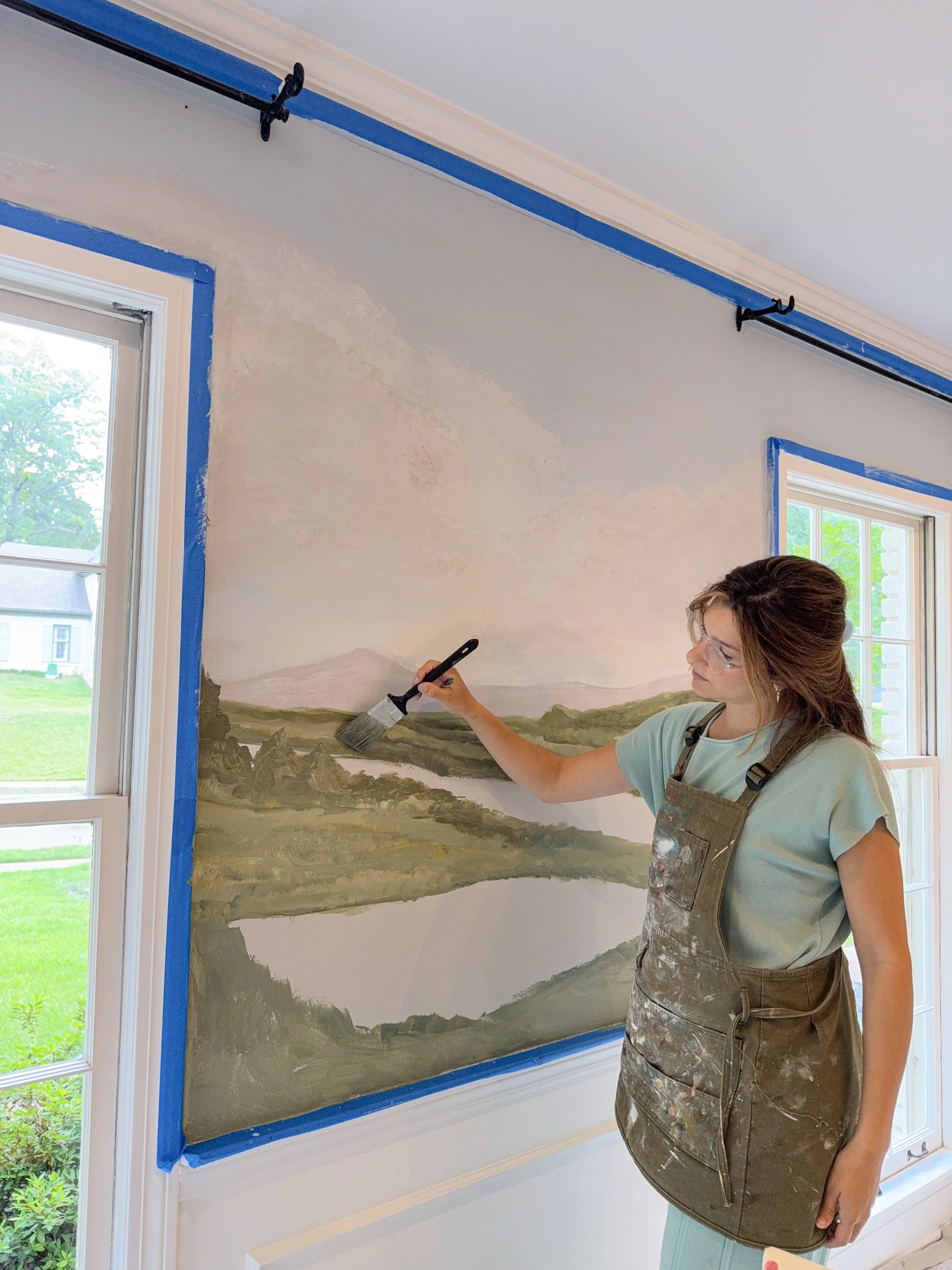 A little progress post from wall two ✨

One of my favorite parts of mural work is watching a blank wall slowly come to life layer by layer. Most days it looks like paint on my clothes, music playing too loud, stepping back every five minutes to stare