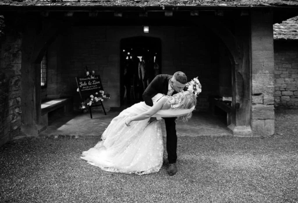Real bride Jade sharing a joyful moment with her husband on their wedding day