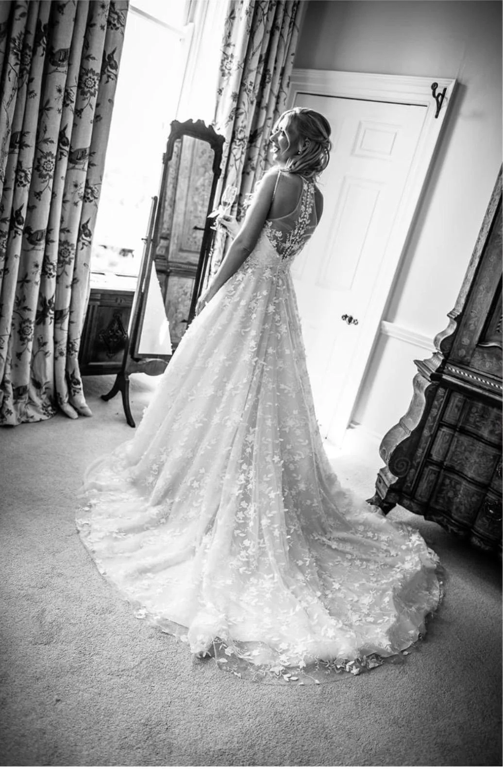 Real bride Jade showing the lace train of her wedding dress