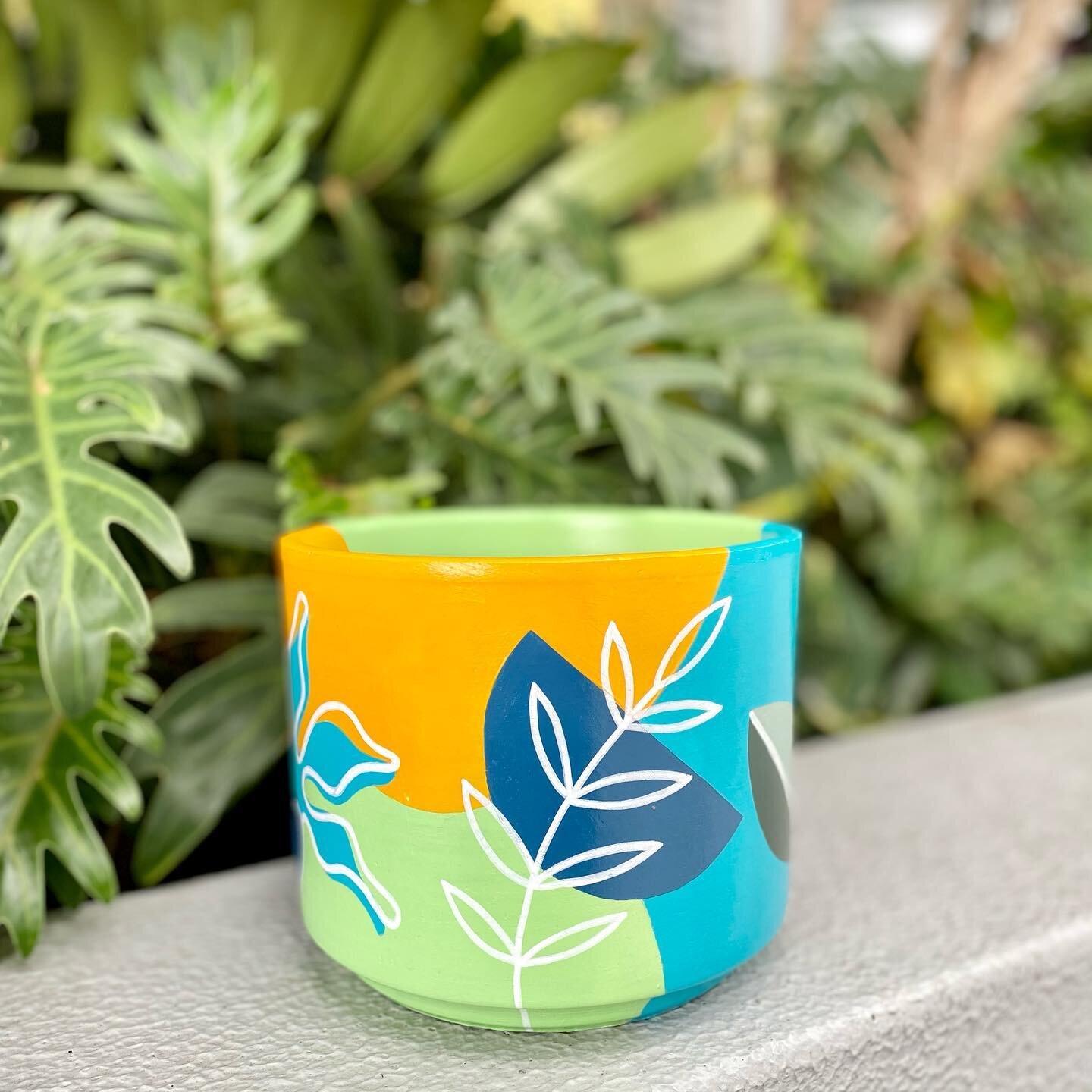 I have a selection of these medium cylinder pots on the website - they are the perfect size for a desk, kitchen counter, bathroom or small side table! This one is painted in the Tropical Sunset Blue design.