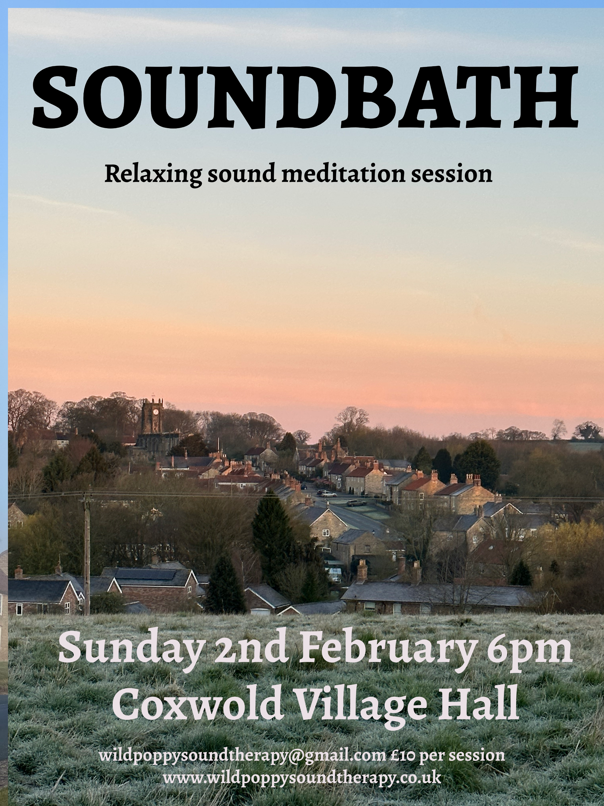 A scenic view of a small village with houses and trees, under a pastel-colored sky at sunset.