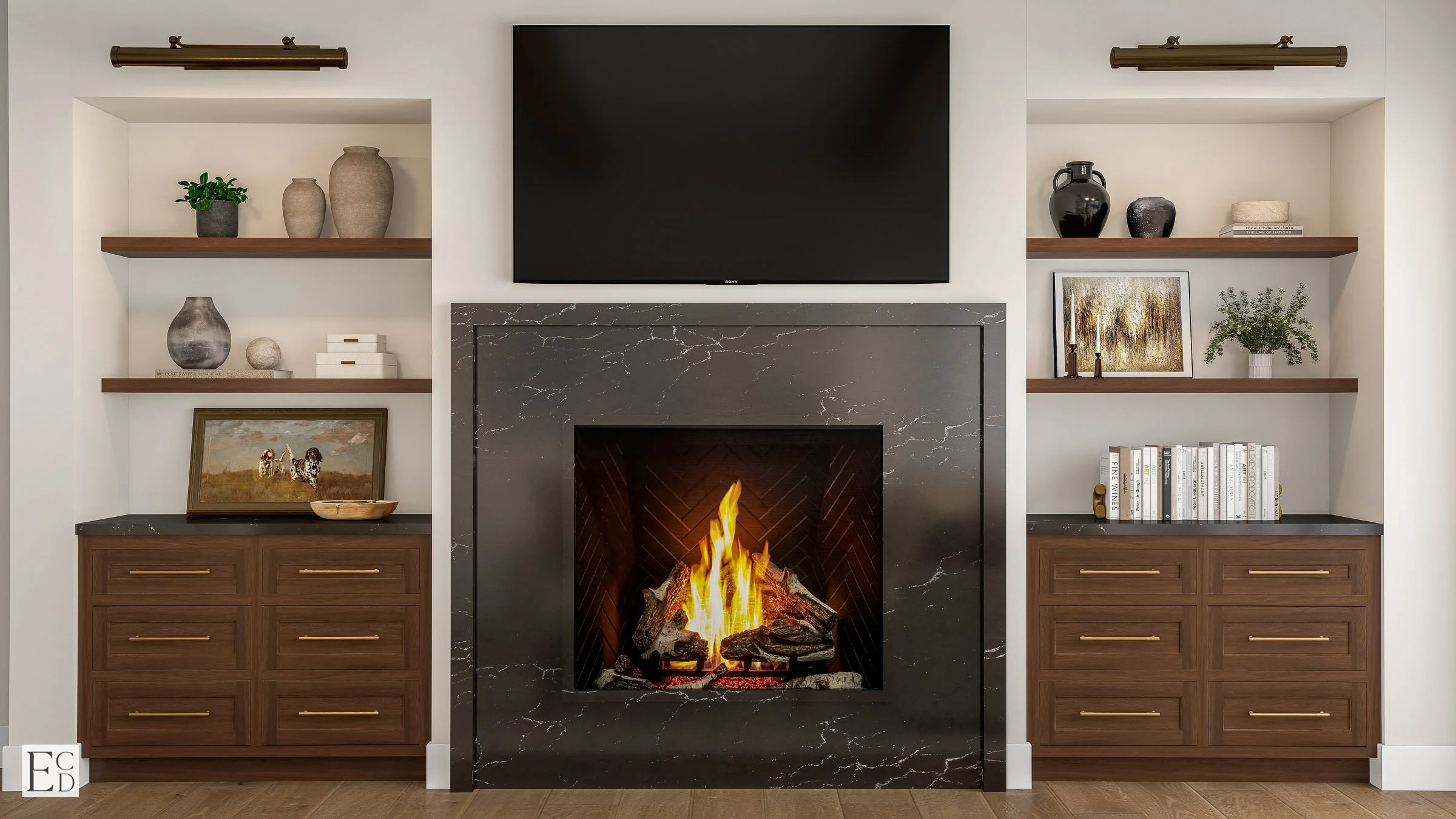 The quartz surround sits between walnut cabinets and floating shelves, picture lights above.