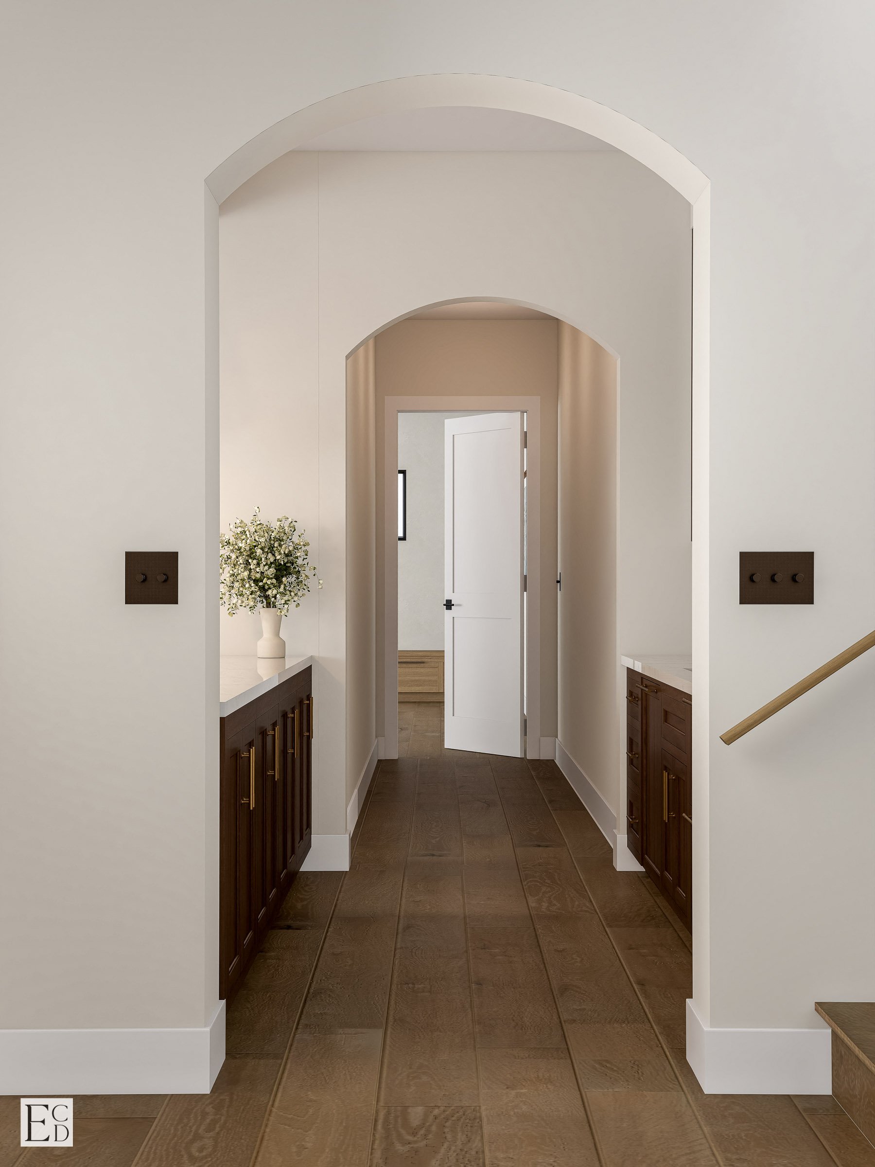 Stacked arches lead down the hall past the bar cabinetry toward the bedrooms.