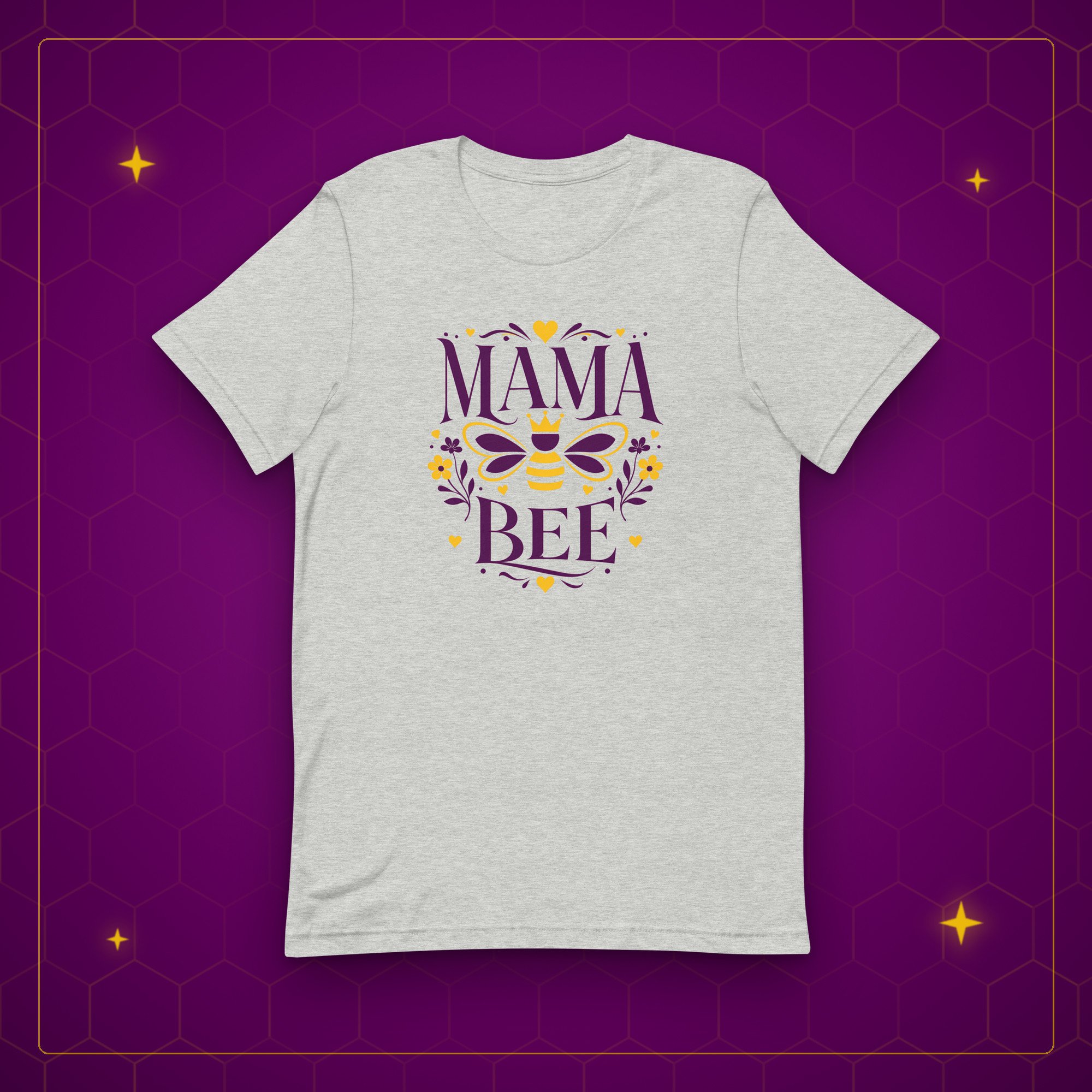 Mama Bee tee in athletic heather, laid flat on a purple background with gold sparkles