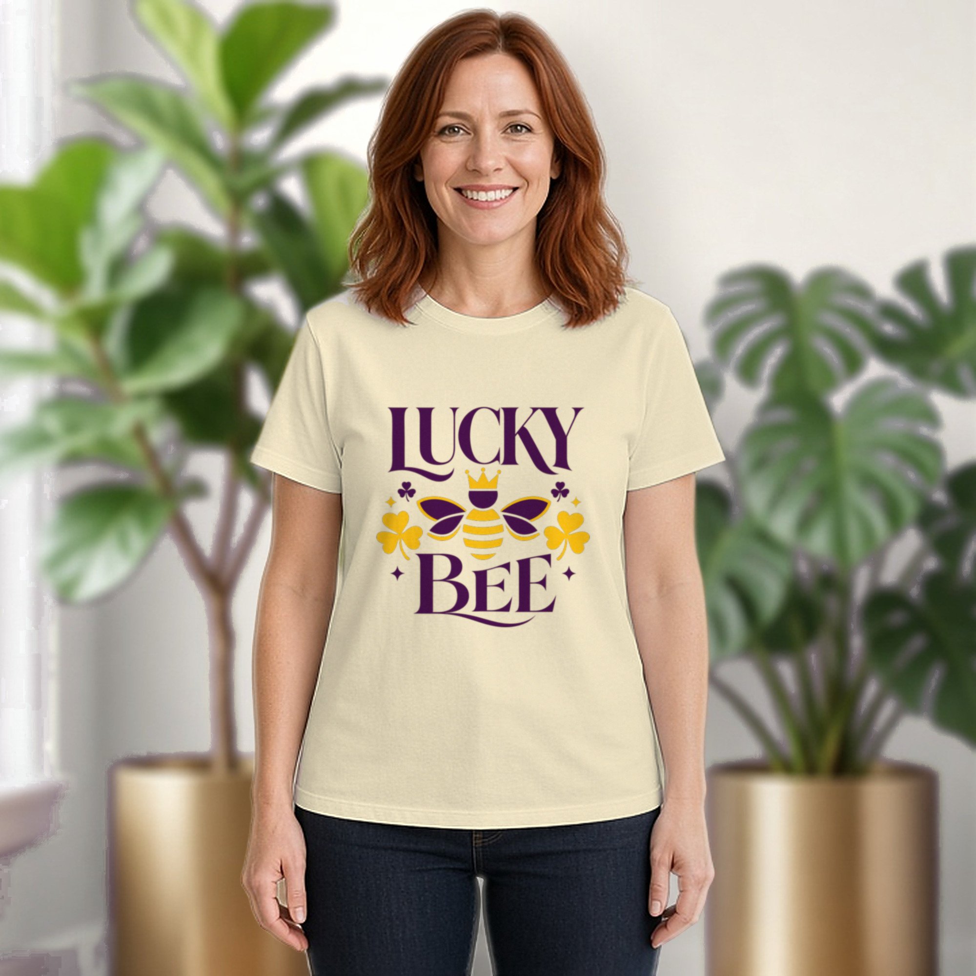 Lucky Bee tee in natural, worn by a model in front of potted plants