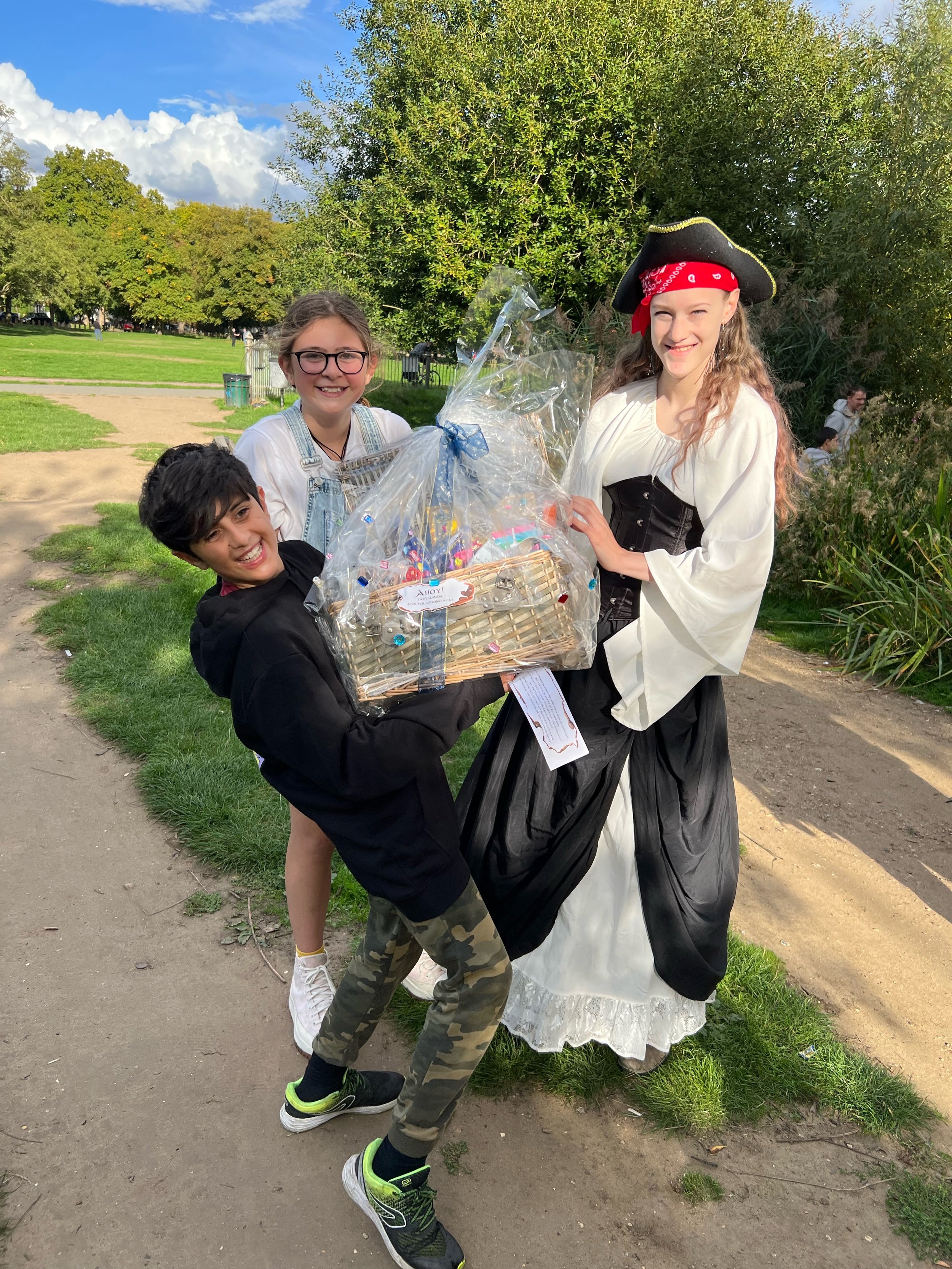The triumphant winners with their loot and the spectacular Pirate Paige!