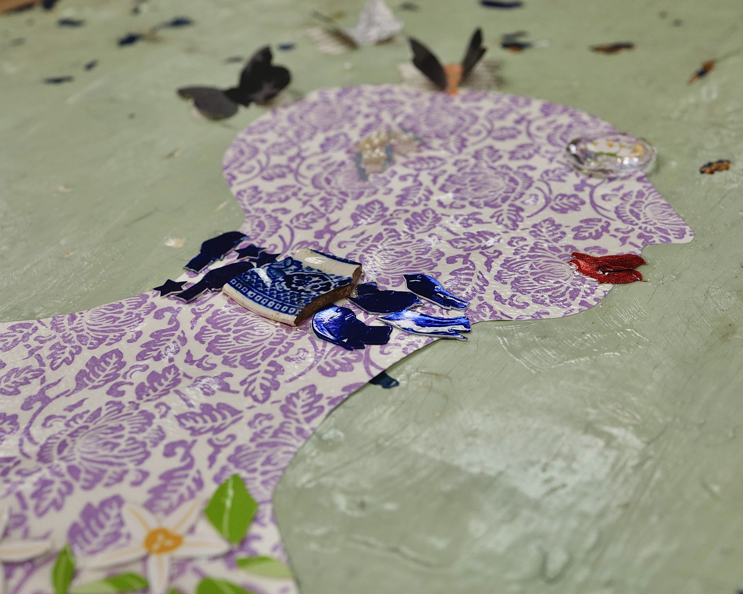 Silhouette with floral pattern and collage elements