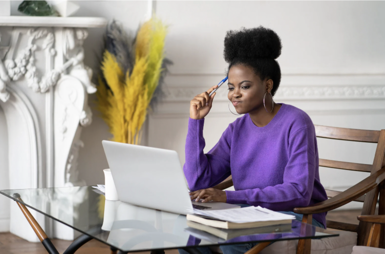High-achieving professional thinking deeply at desk, symbolizing overthinking and perfectionism