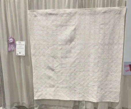 White on White: No. 6 Log Cabins (2025) at QuiltCon