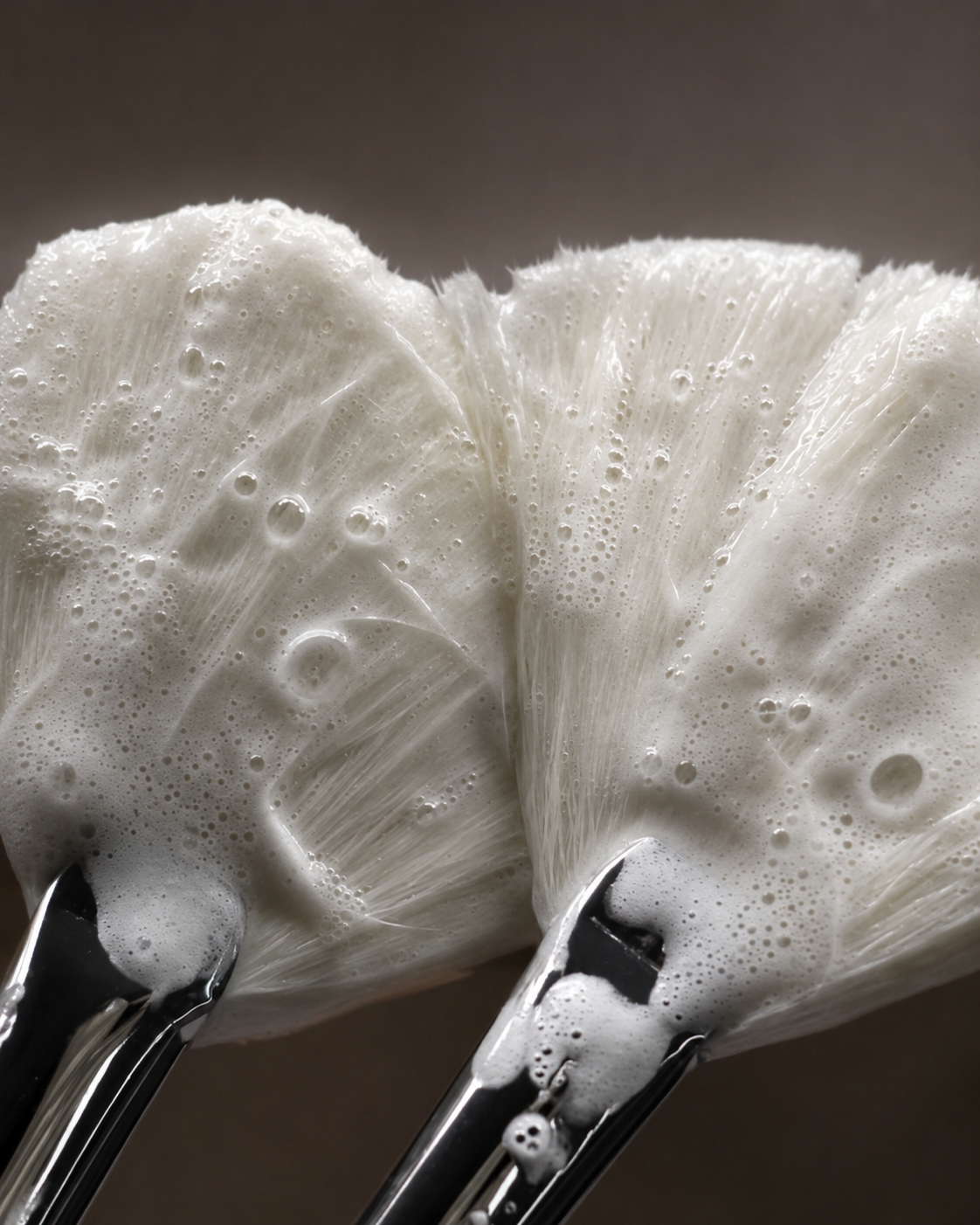 Fan facial brushes covered in bubble used for professional skin cleansing