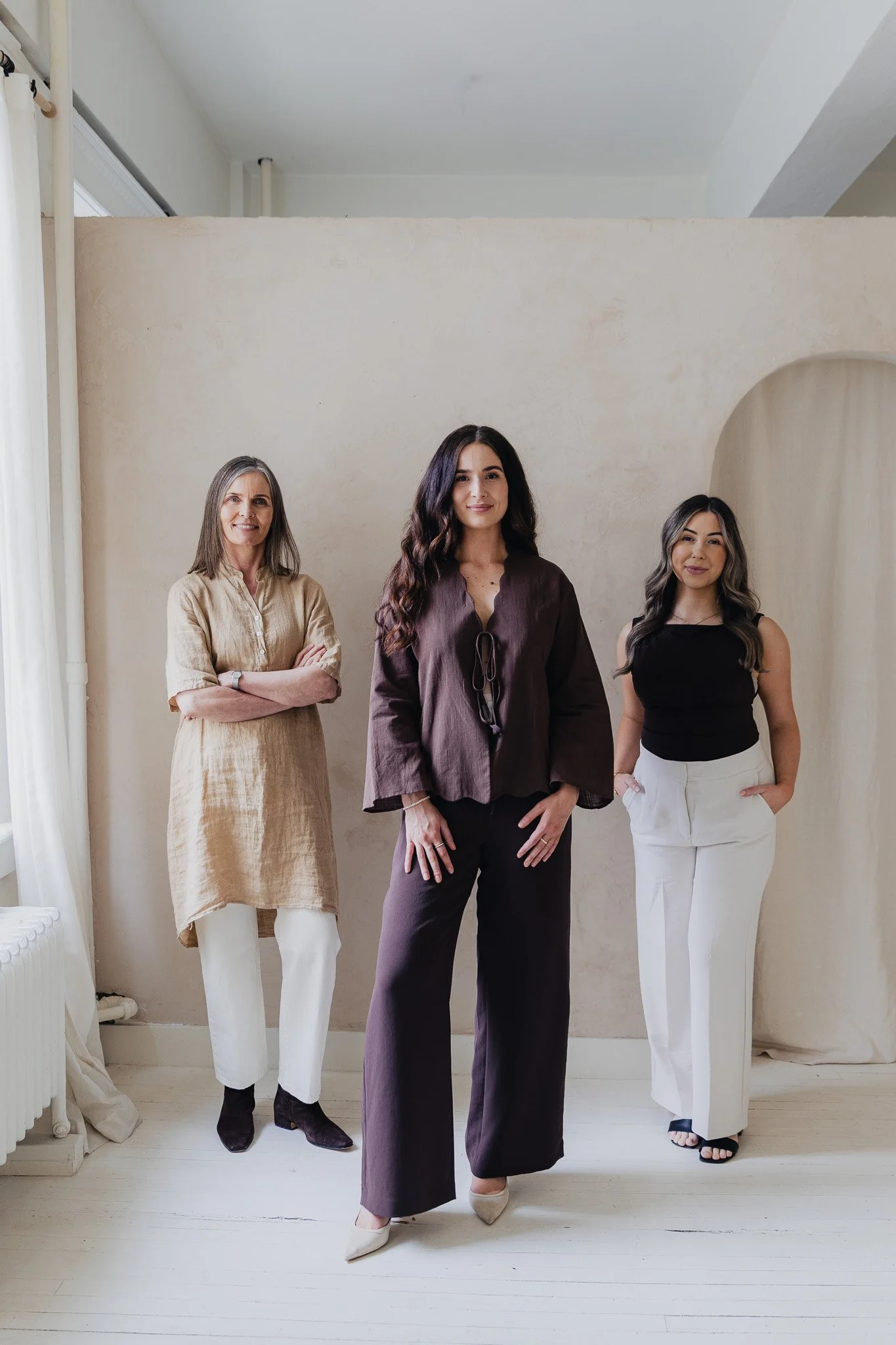 Three members of the JRAD SKIN team photographed inside the Calgary clinic