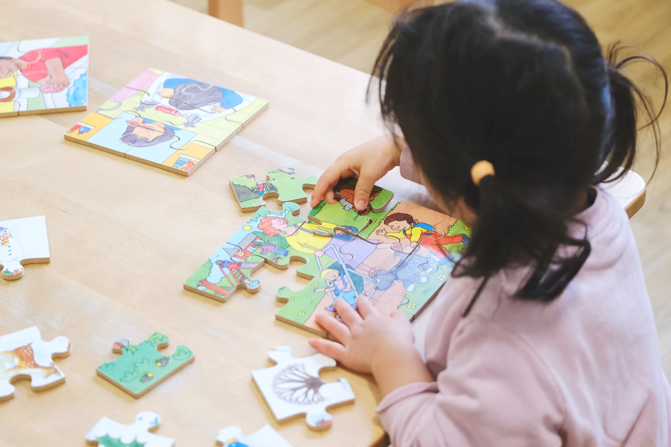 Child completing a puzzle