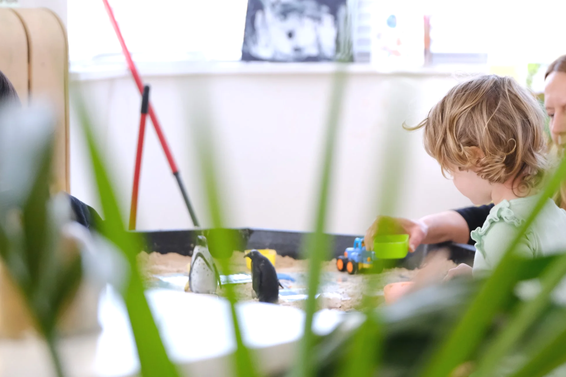 Child playing with sand pit