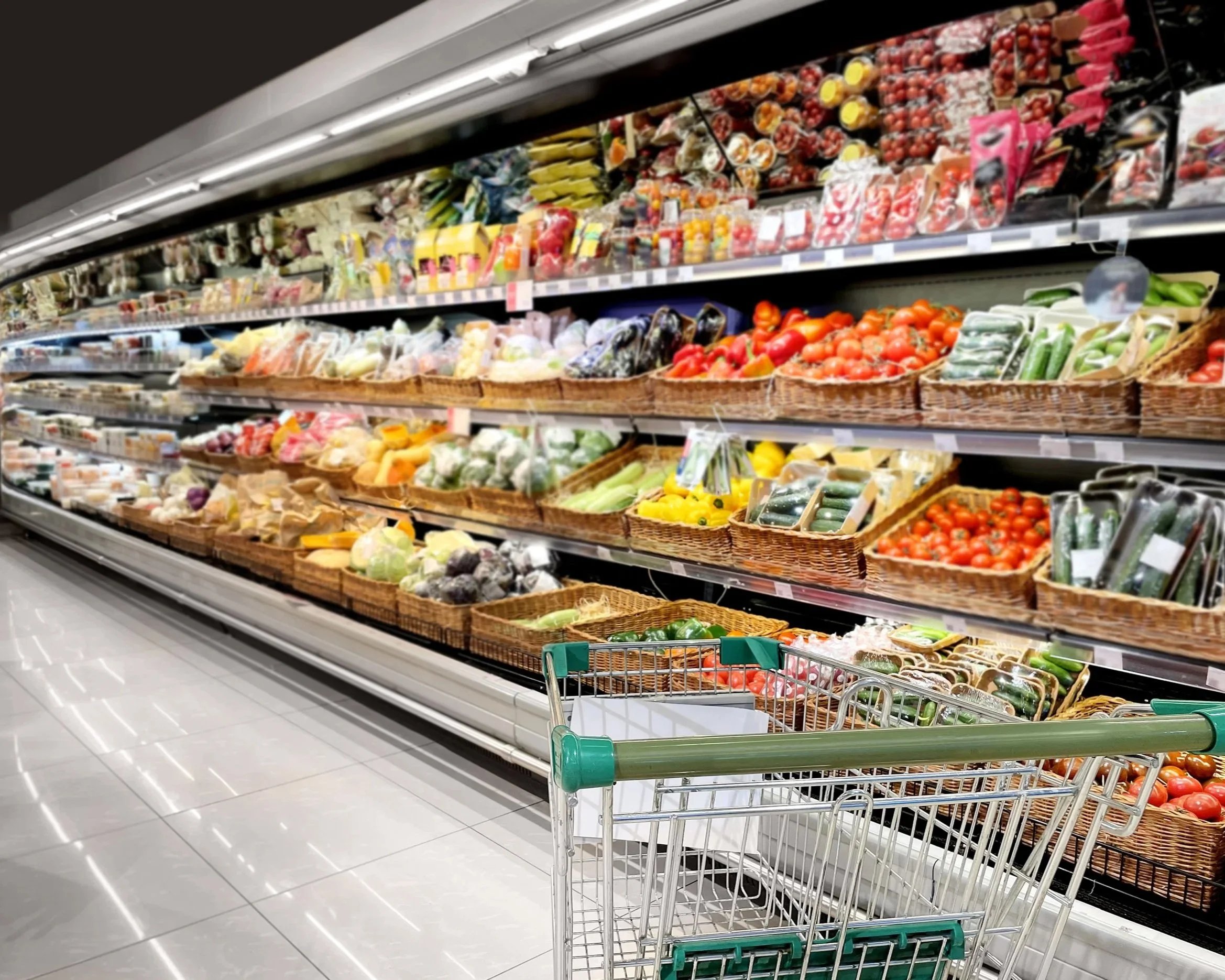 supermarket isle filled with fresh vegetables
