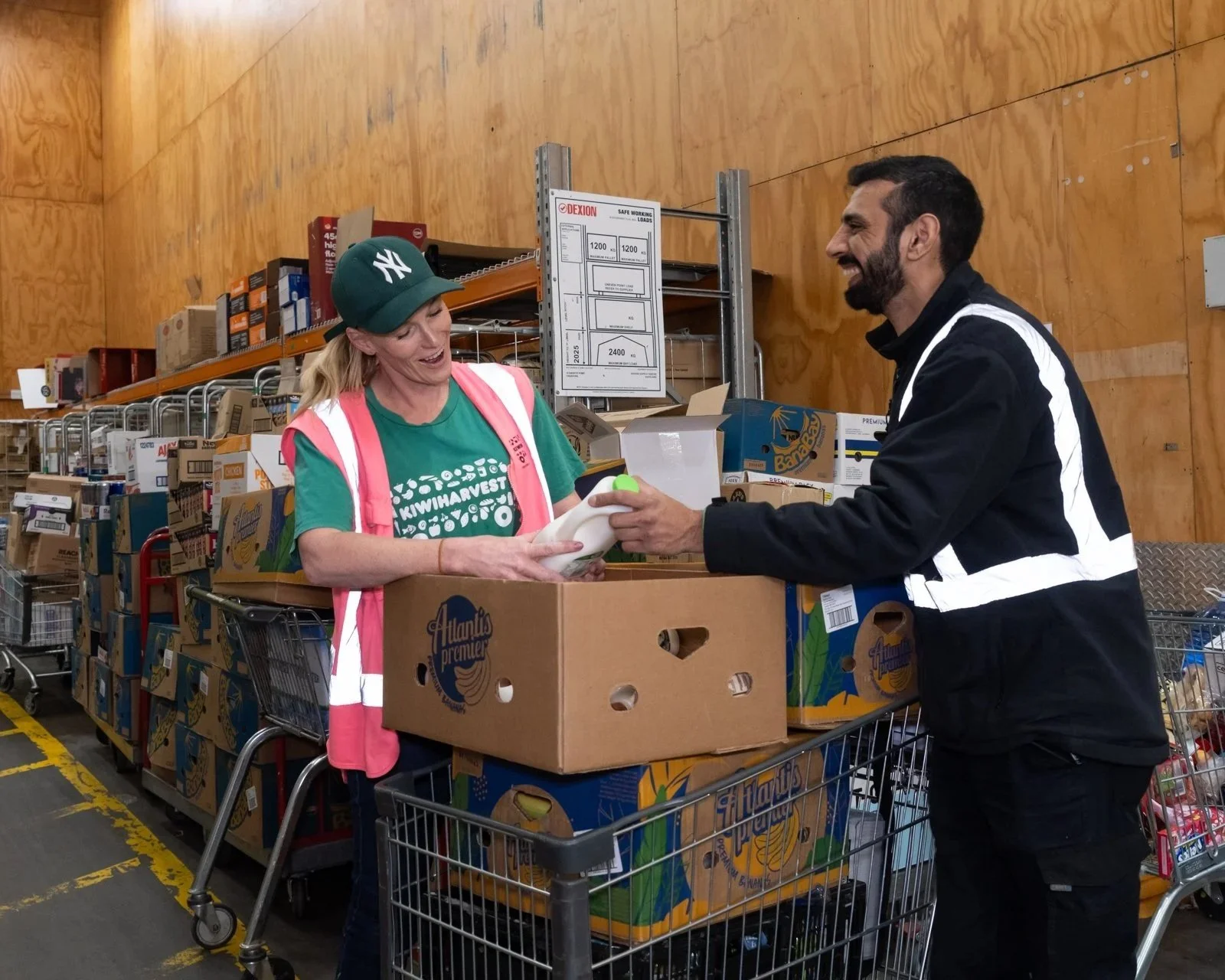 KiwiHarvest food rescue driver and Woolworths store manager, filling a box of donated food from Woolworths