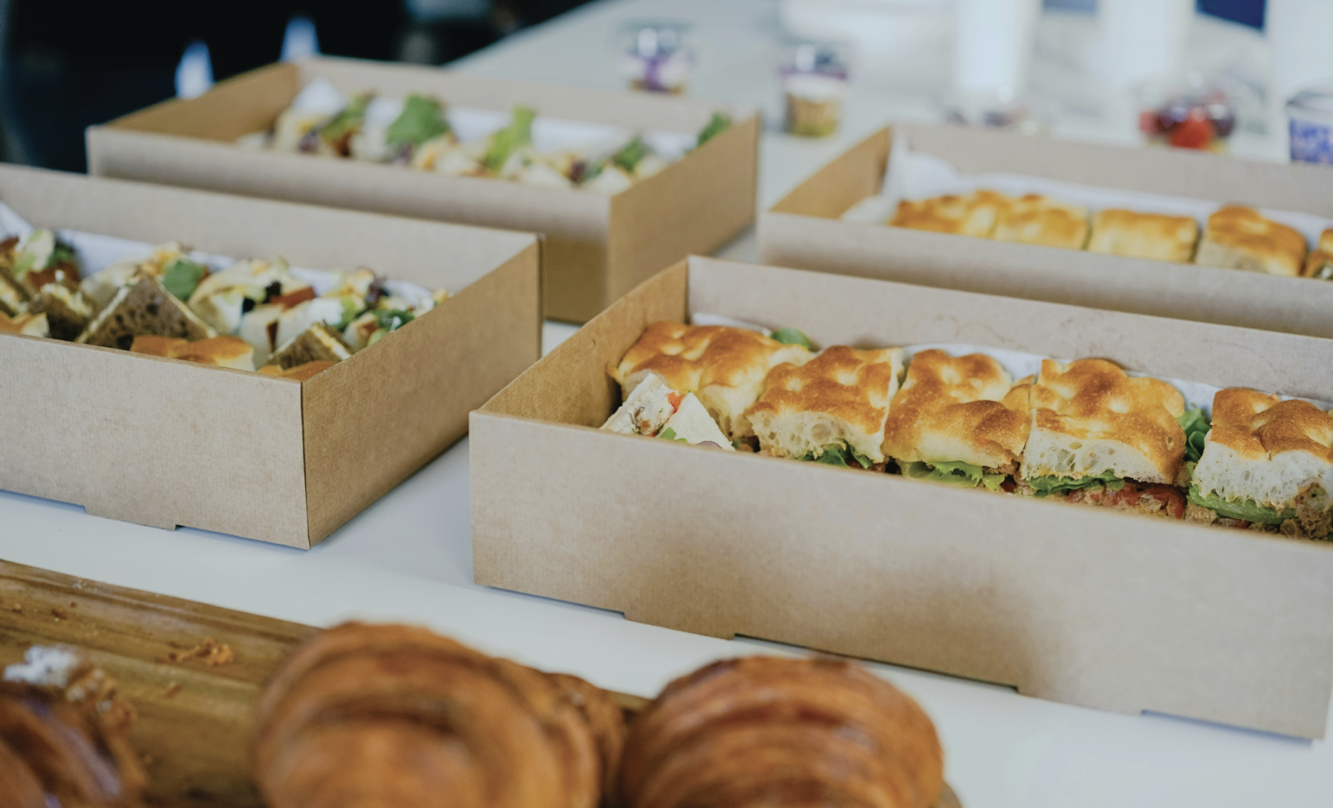 Table of fresh catering sandwiches in boxes