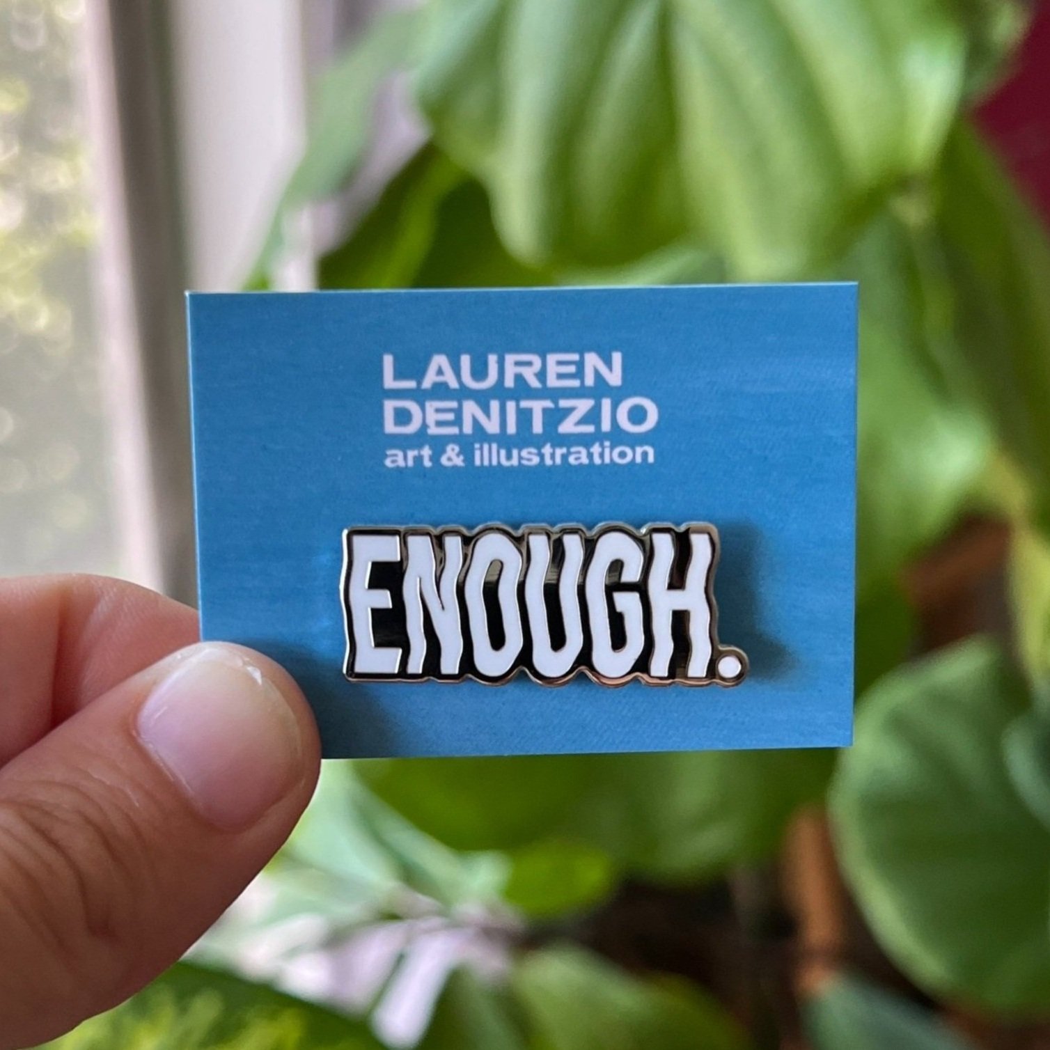 Enough_Enamel-pin_mounted.jpg
