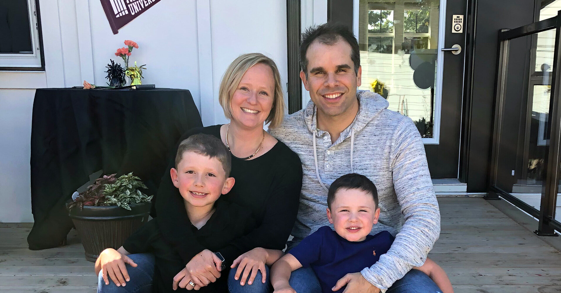 Mark at home with wife Meghan, and sons Carter and Sawyer.