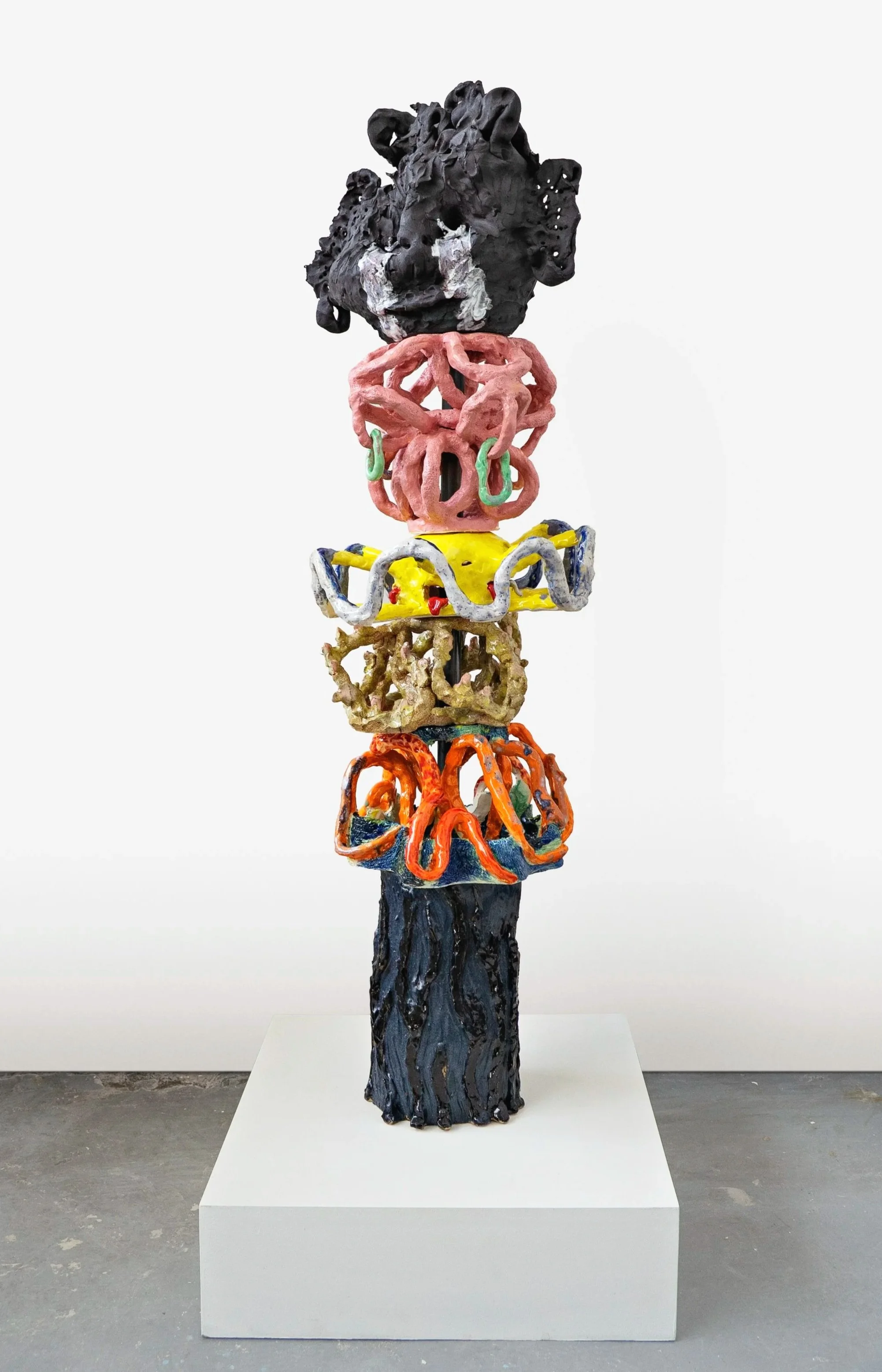 Layers of Emotion (2026), Ceramics, metal pole, wooden plinth, weights, 140 x 50 x50 cm