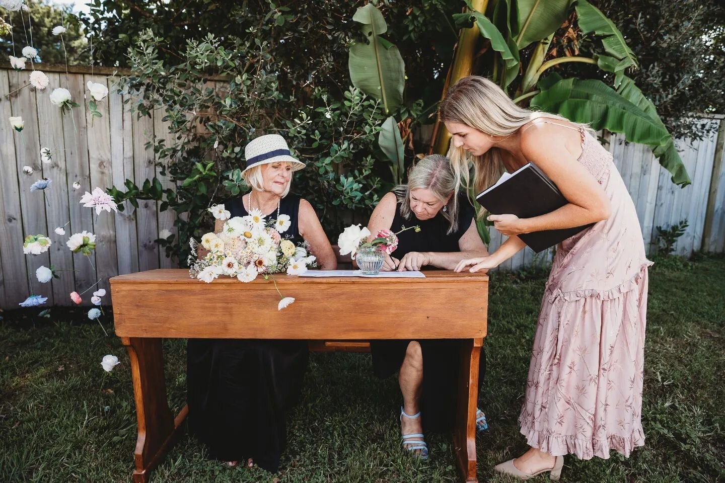 Signing Sarah and Simons paperwork under their banana tree in their own backyard (tropical oasis) in Matapihi.

This is as close to a tropical wedding as a celebrant of New Zealand is allowed to officiate. 

We are only allowed to marry couples withi