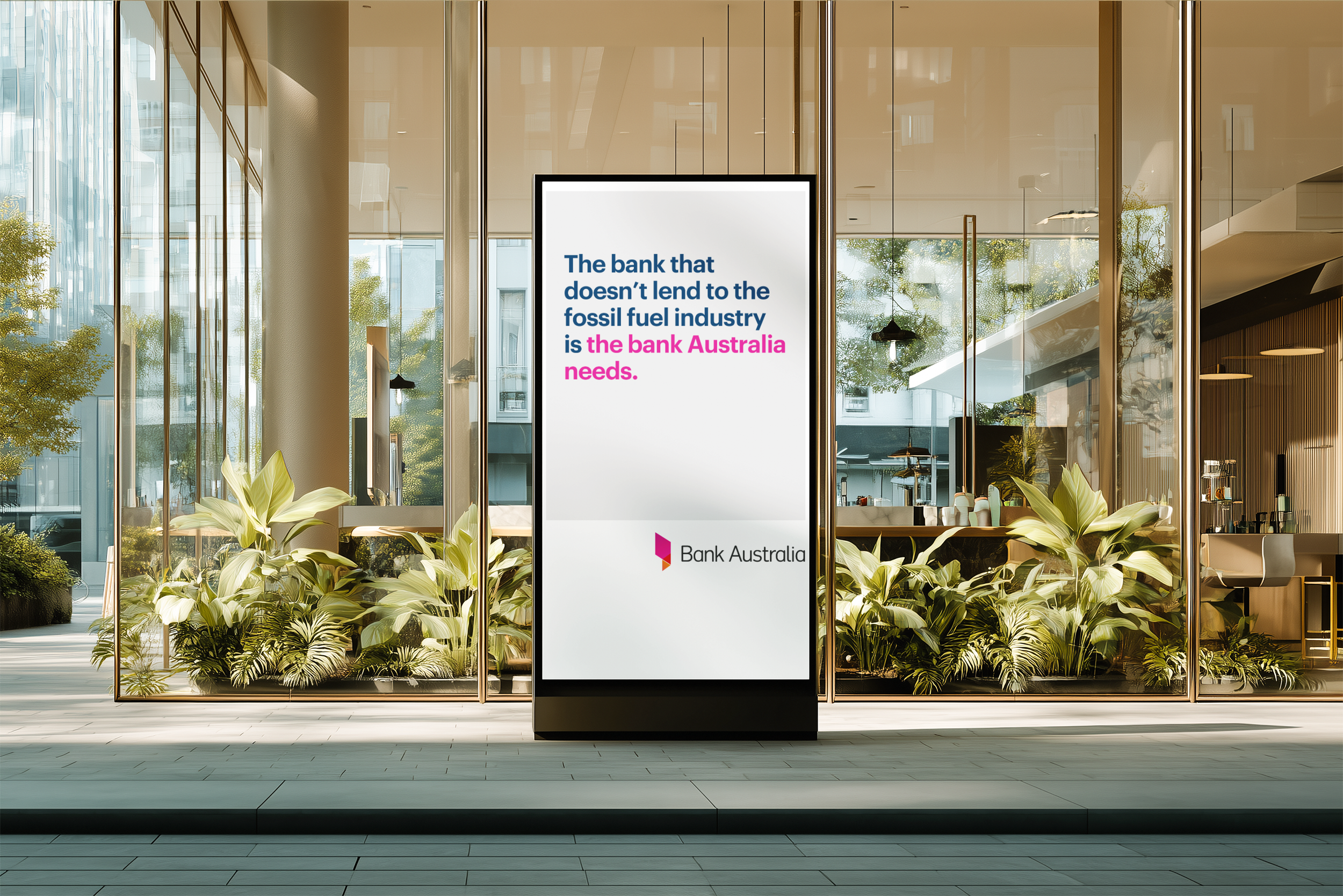 Digital display in an office lobby promoting Bank Australia, with glass walls, plants, and a glimpse into the office interior in the background.