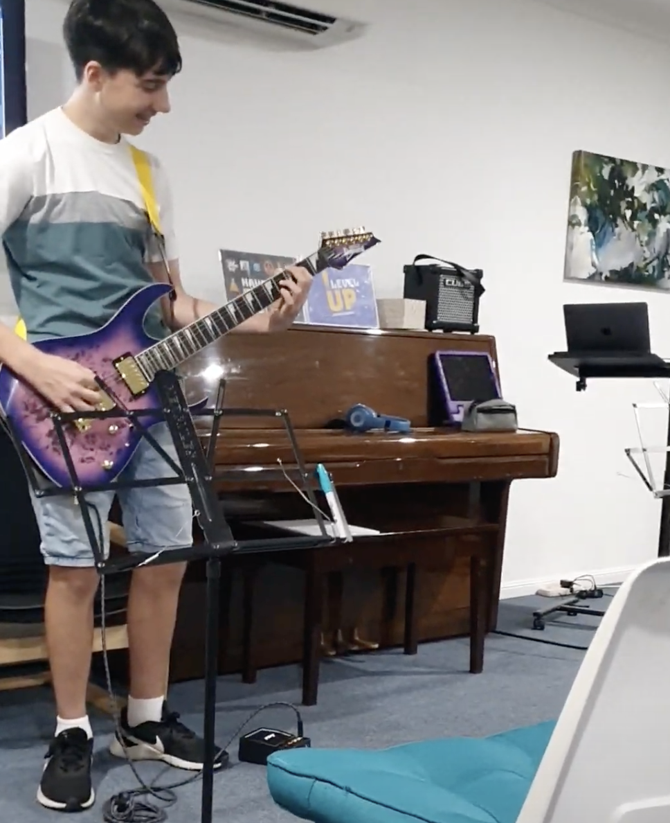"My teenage son loves learning guitar at Level Up Guitar School. He gets to learn guitar through songs he loves and enjoys working with the other students in his class. Alex is a great mentor and role model to the students and builds a love of musici