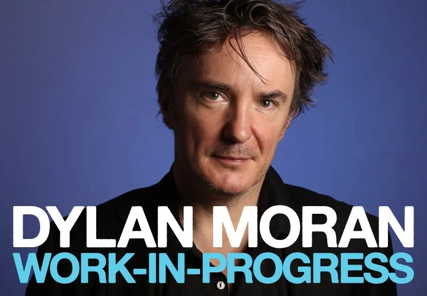 Promotional image of Dylan Moran with text 'Work-In-Progress'.