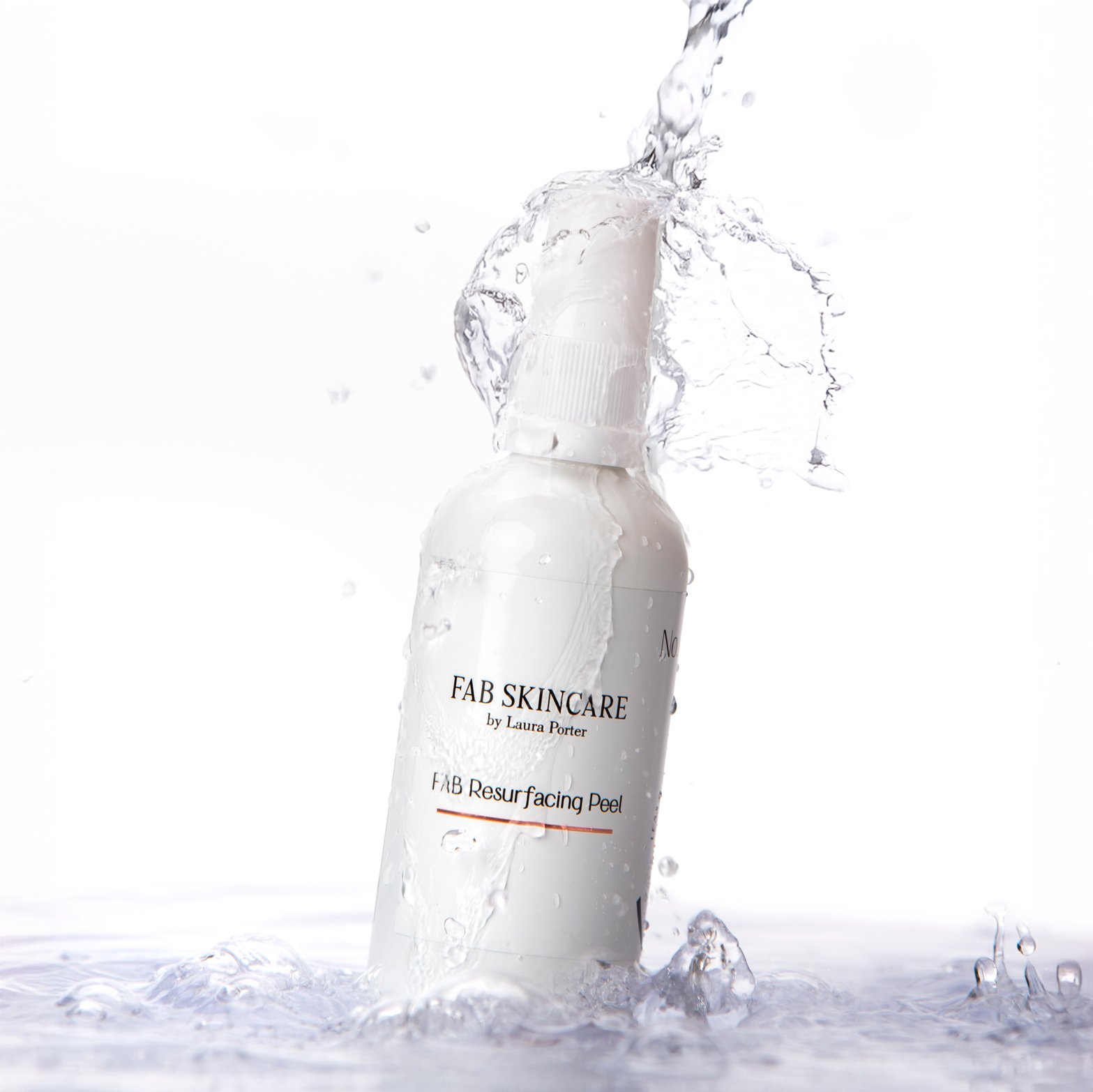 hero product photography showing a white bottle of No3 fab skincare with spray nozzles, balancing on water with water splashing over the product