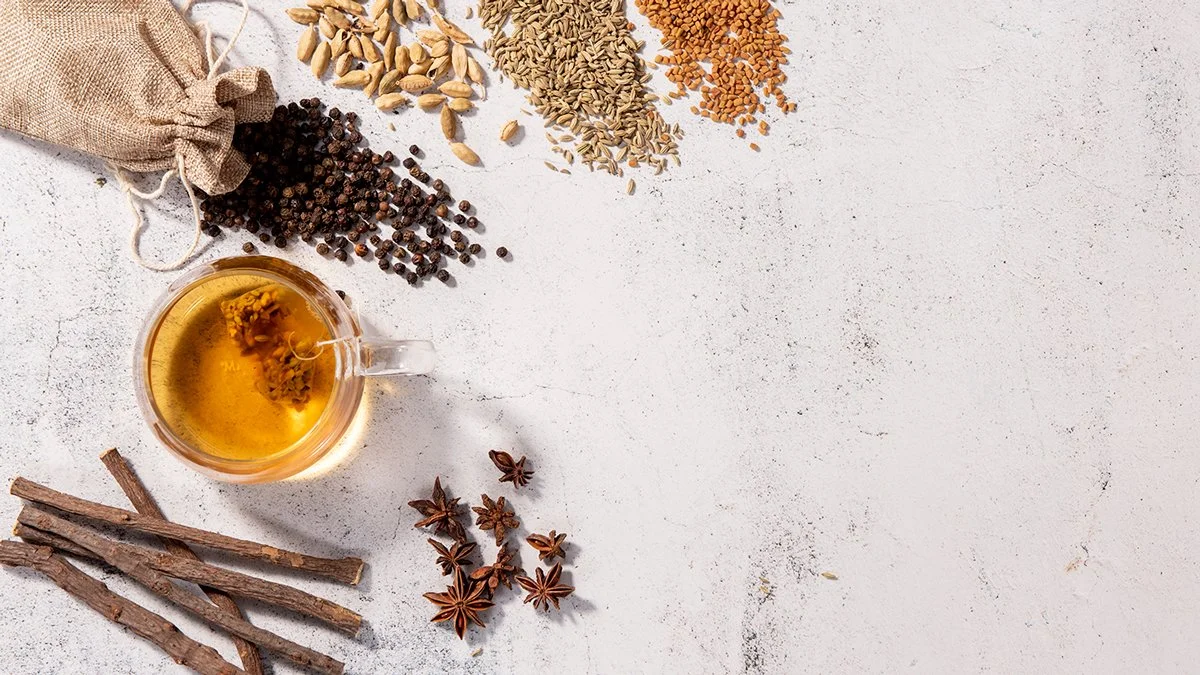 health care tea on white textured background with props spices flat lay photography from roy mccready