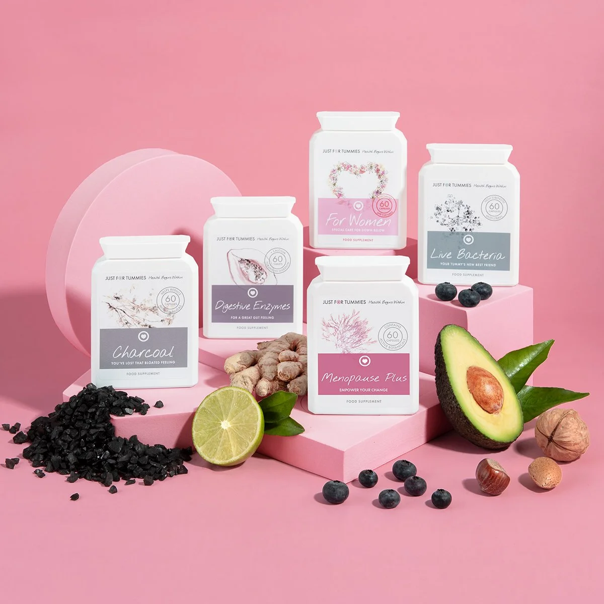 health care supplements vitamins on pink background with props product photography from roy mccready 
