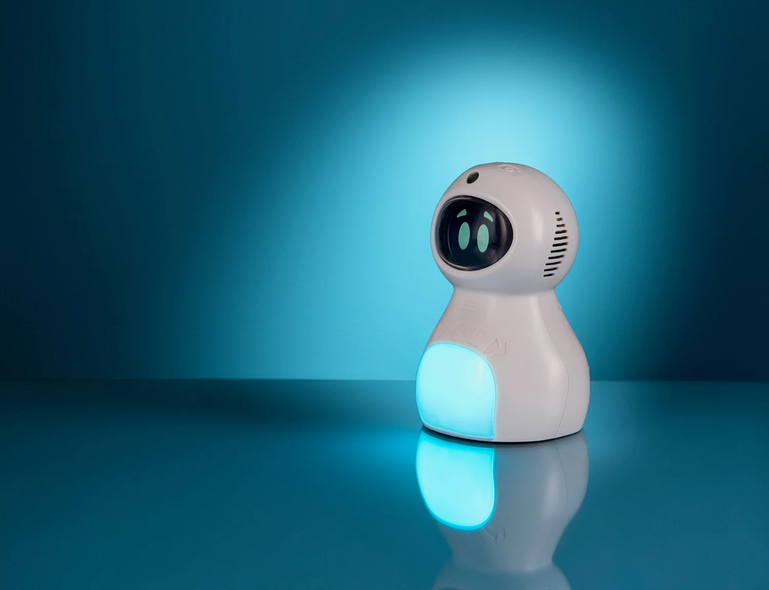 hero product photograph for tts educational white plastic robot with a screen showing cute eyes on a graduated blue background and reflective surface