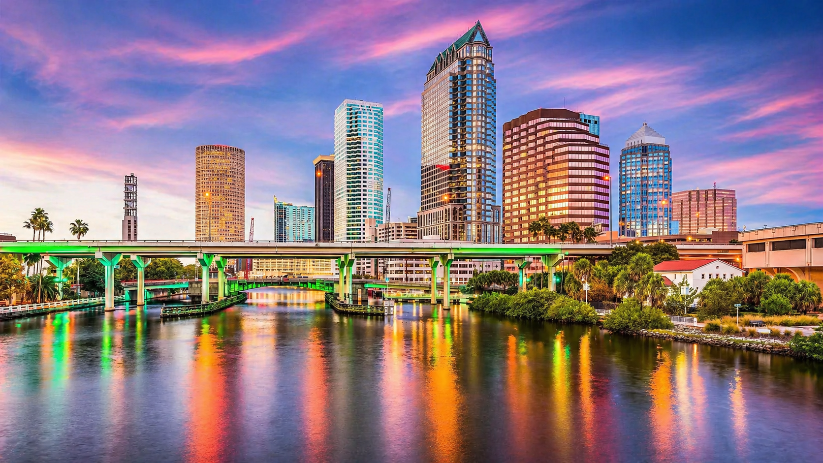 Downtown Tampa skyline at sunset with riverfront view and modern luxury high-rise buildings