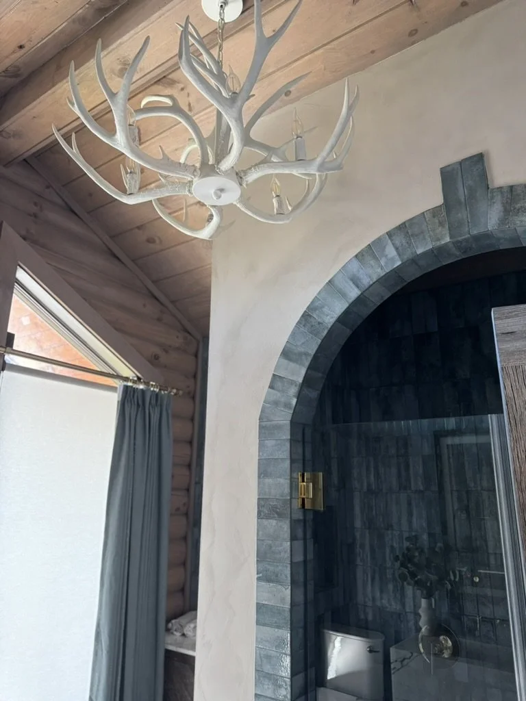 Ceiling light fixture resembling white deer antlers with bulbs