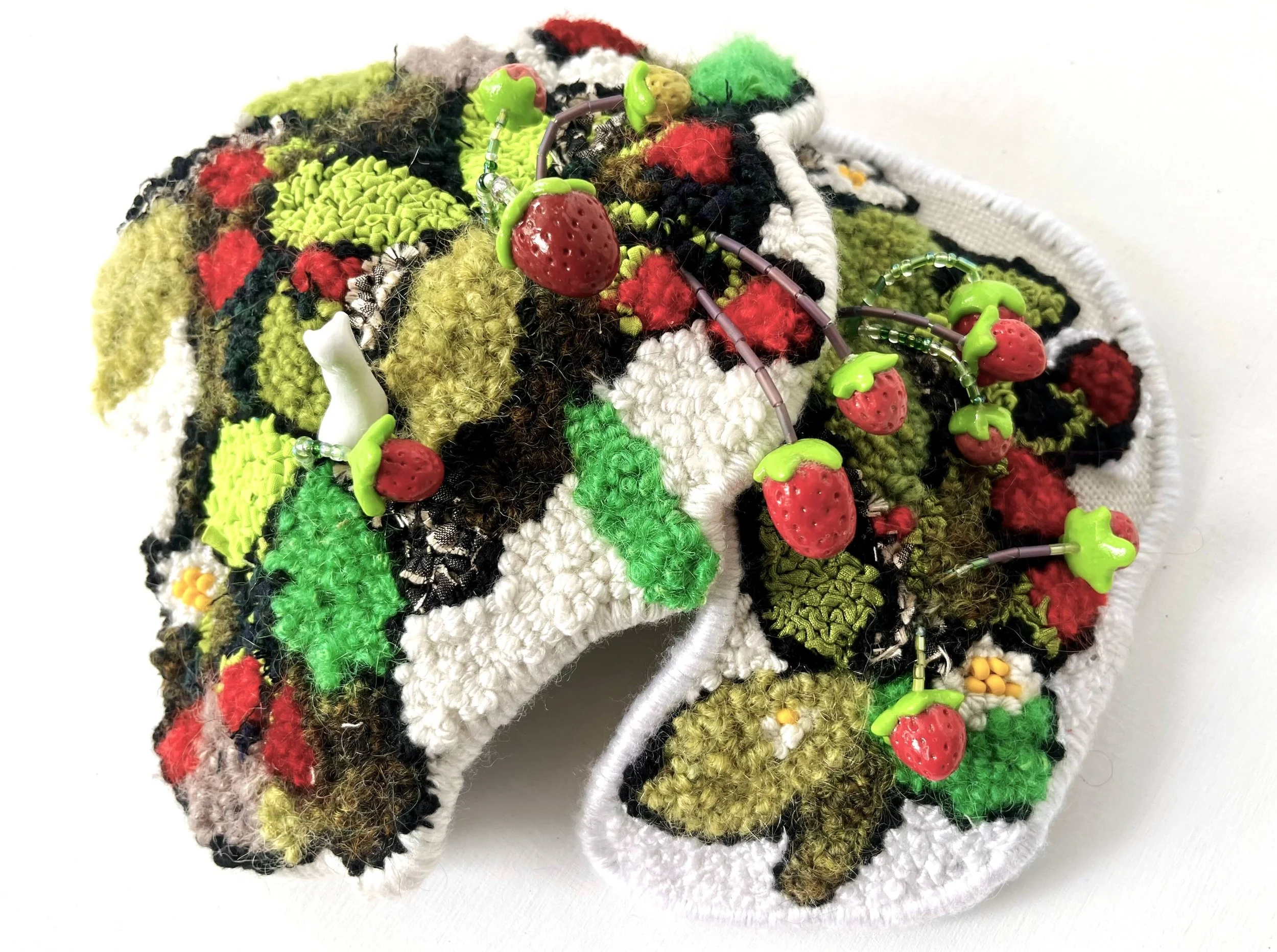 Wild Strawberries, 10” W x 3.5” H x 8.5” D, Repurposed and metallic textiles, yarn, beads, clay $425