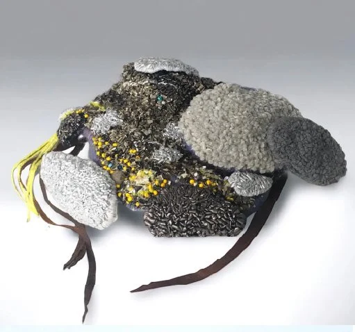 Capelin Eggs, 15"W x 11" H x 3" D, Repurposed and metallic textiles, yarn, fish leather, beads $400.