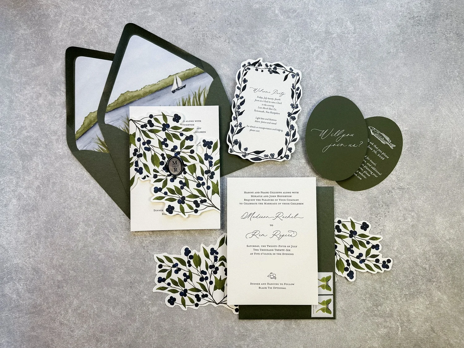 Layered botanical wedding invitation suite with an original coastal watercolor envelope liner and a custom die-cut wrap