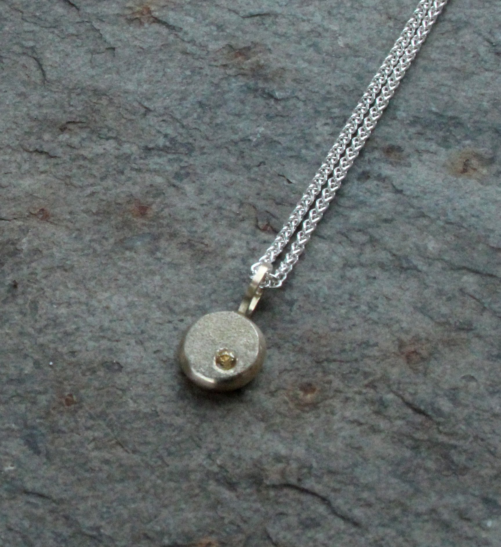 Yellow Gold Sand Pebble Pendant with Sapphire.jpg