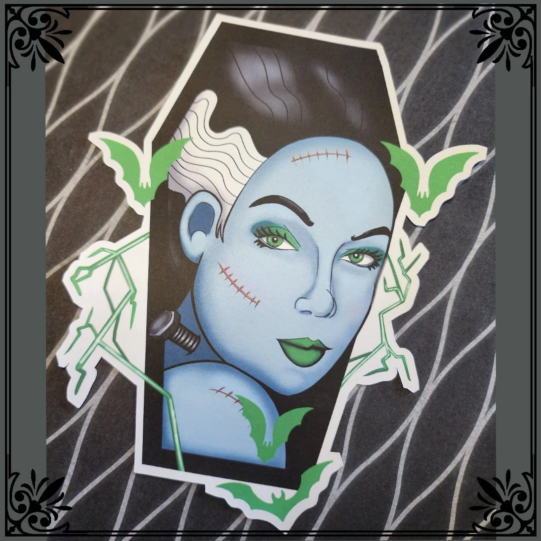 Illustration of a female Frankenstein monster with blue skin, green eyes, dark hair, and stitched scars, surrounded by green bats and lightning bolts on a dark background.