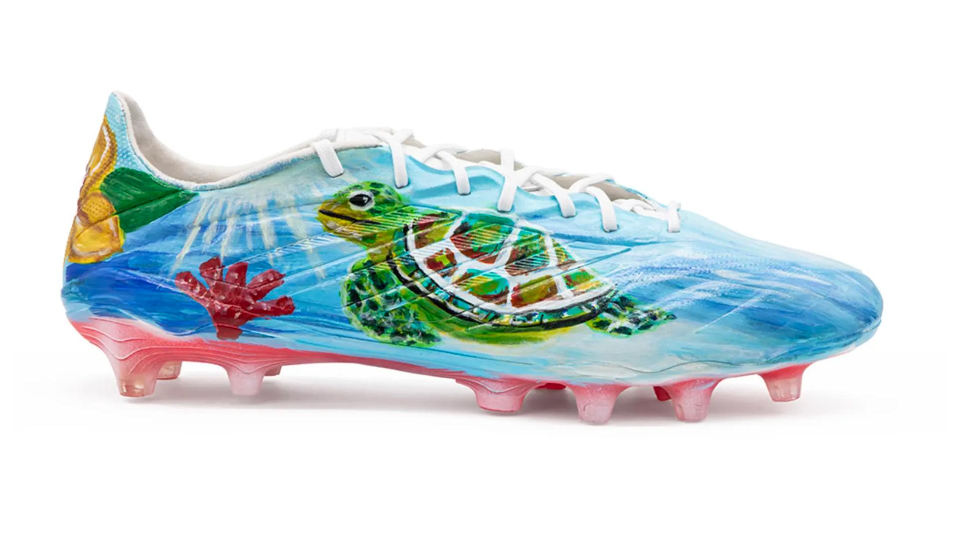 Custom painted football boots for the British Virgin Islands by artist Alexandra Seda, also known as Miss Lushy, with a sea turtle and ocean design, Kicks of Concacaf, FIFA World Cup 2026.
