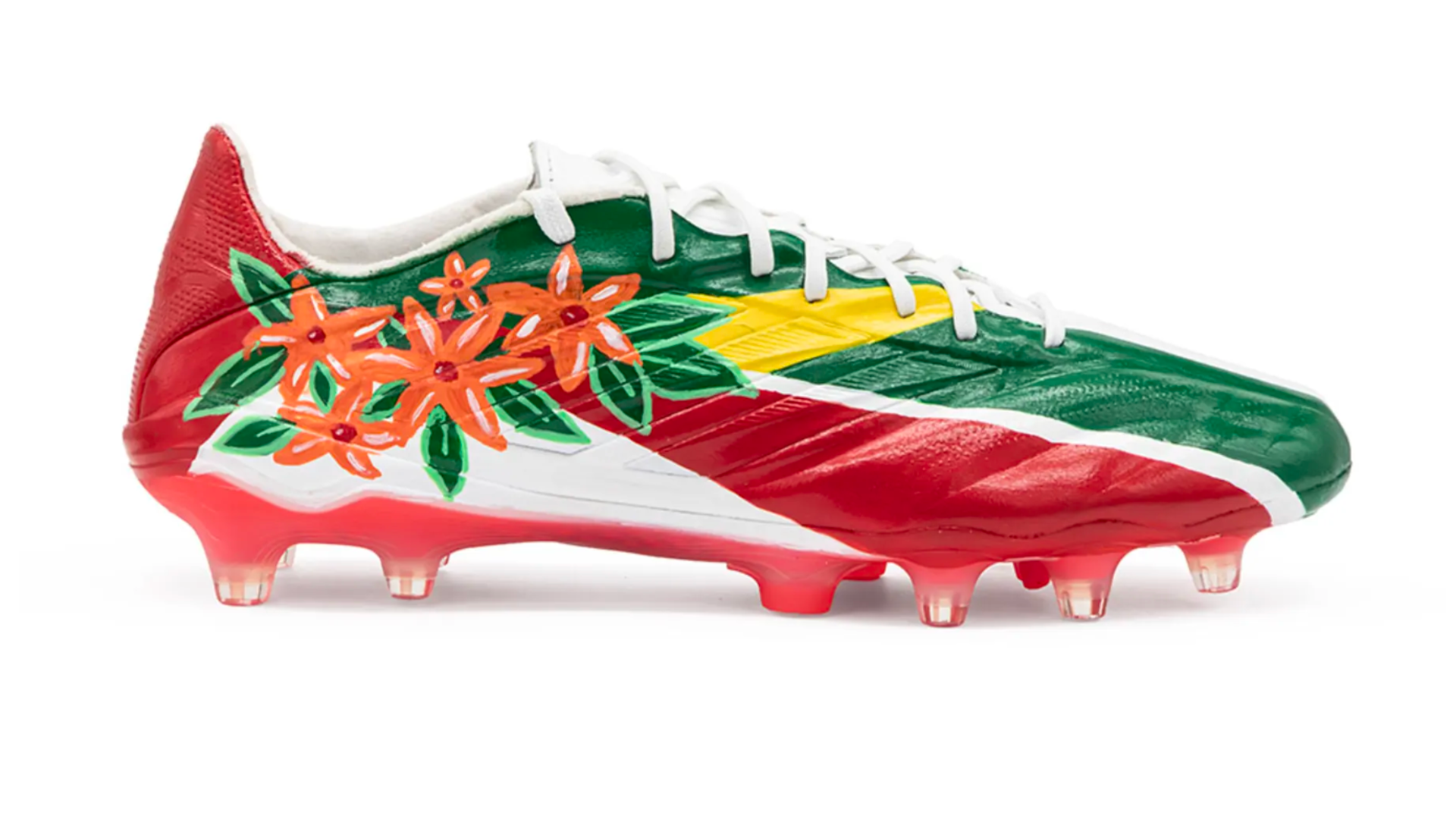 Hand-painted soccer cleats for Suriname by artist Alexandra Seda, also known as Miss Lushy, featuring Ixora blossoms and rainforest colors, Kicks of Concacaf, FIFA World Cup 2026.