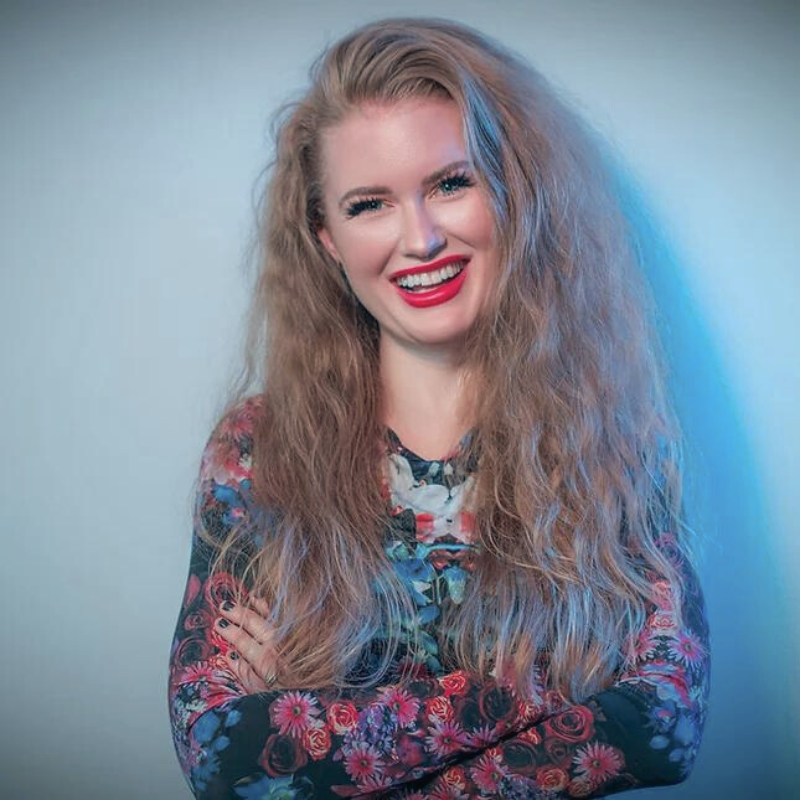 Former client looking grounded and calm after nervous system healing work