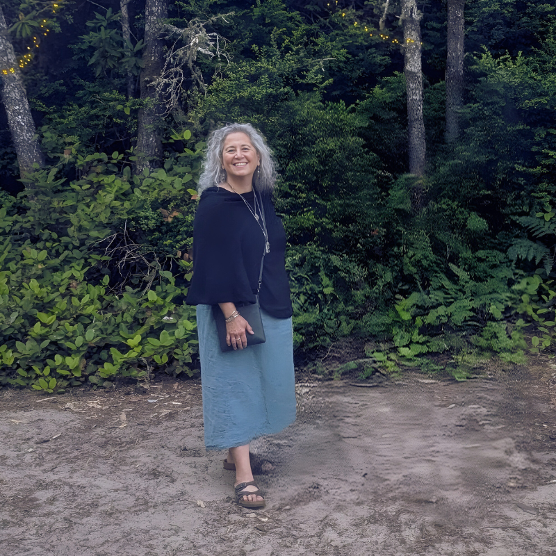 Woman smiling softly after working with Emily Rose on somatic and relational healing