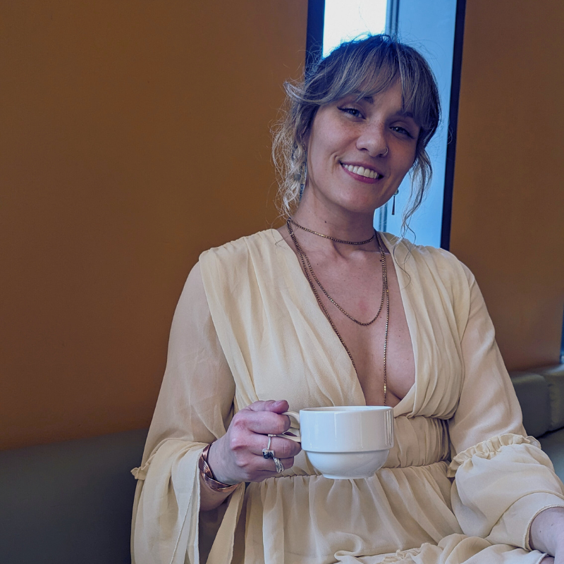 Woman sharing her story with Emily Rose during an intimate, trauma-informed session