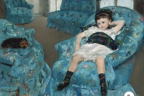 little girl in a blue armchair.jpeg