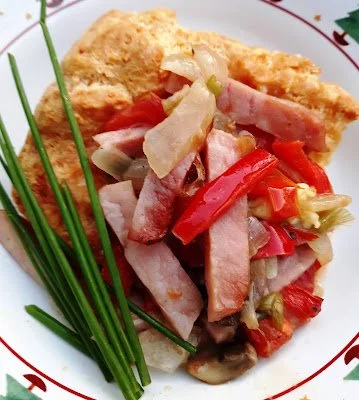 Gougere with ham, peppers and gruyere cheese. (French)