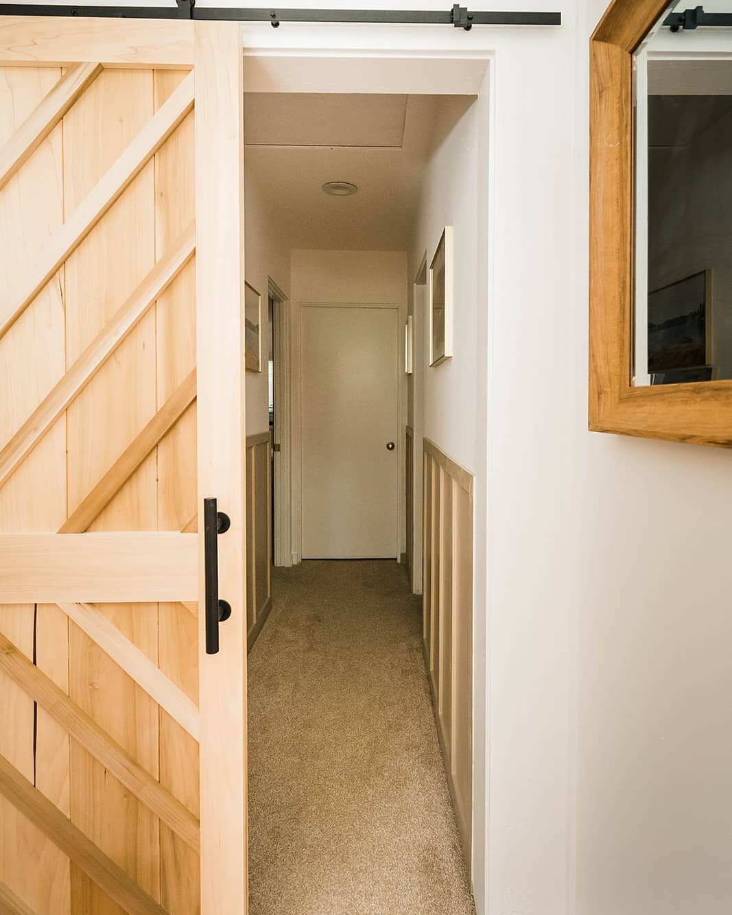 So much labor of love went into this home ❤

We love building and creating, so  a lot of the details throughout our  Hsu Casa were handmade. This farm door was handcrafted by Ray, along with the detailing in the hallway. We wanted to have thoughtful 