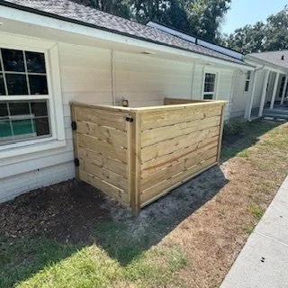 Custom cedar pool equipment cover installed at an Ortega home in Jacksonville, Florida, designed to conceal mechanical systems while matching the home’s exterior.