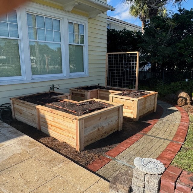 “Handcrafted cedar planter boxes with integrated irrigation system at Ponte Vedra Spa & Club, built for durability and year-round vegetable gardening.”

