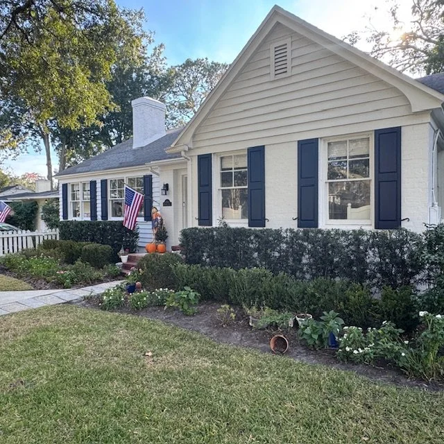 Custom exterior wood shutters installed on an Avondale Jacksonville home, enhancing curb appeal with classic coastal-style detailing.